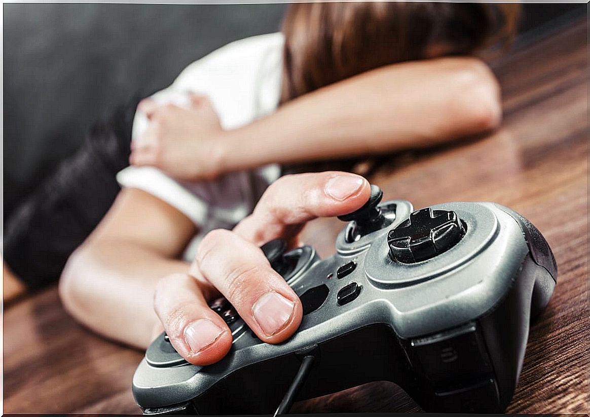 Boy on the floor with video game controller