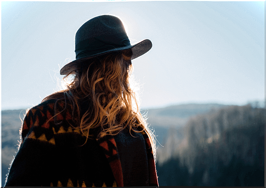 Blond haired woman looking back