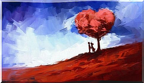 Couple next to heart-shaped tree