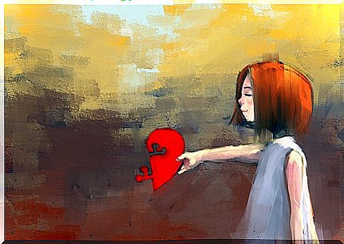 Woman holding broken heart 