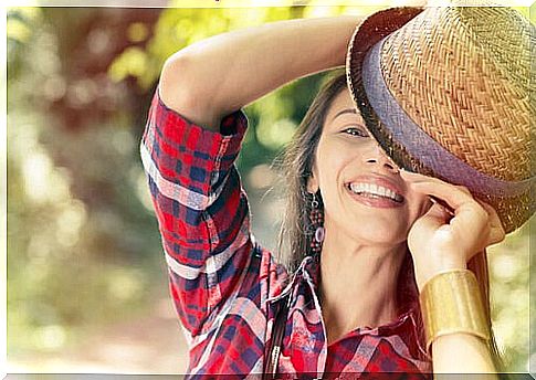 Woman smiling with a hat on her head