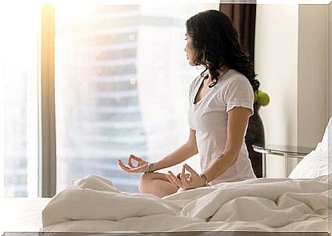 Woman meditating to clean up her emotions