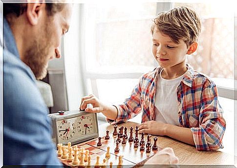 Man playing chess with a child