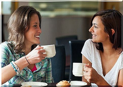 Girlfriends having coffee having interesting conversations