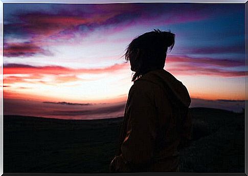 Boy alone observing nature