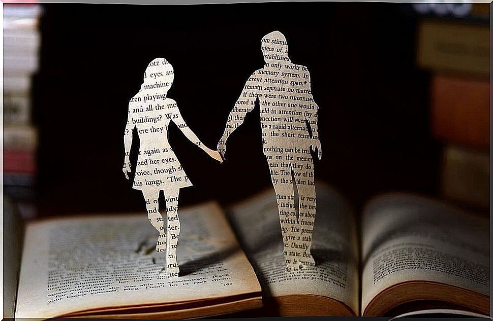 Paper couple symbolizing love in smart people