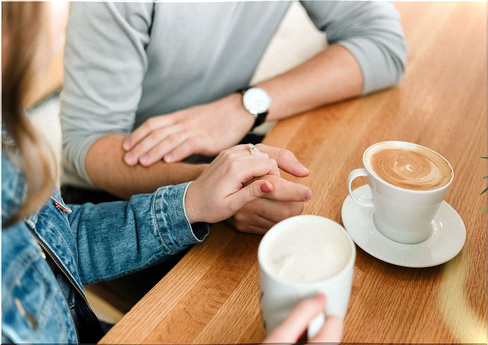 Couple talking and having coffee.