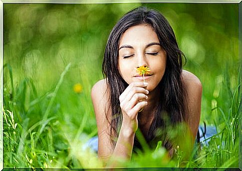 Woman lying in the field enjoying the dolce far niente