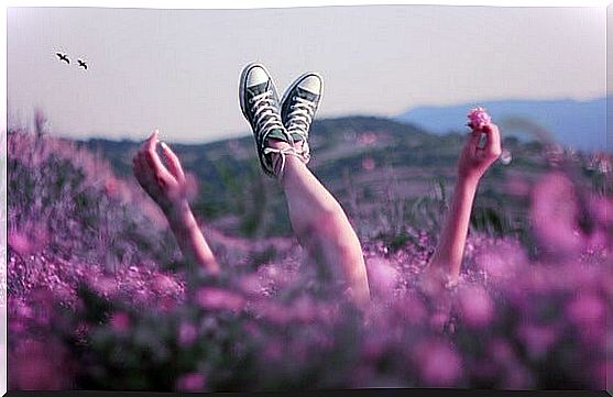 girl lying in the field representing calm people 