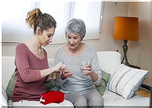 Daughter helping her mother as an example of caring