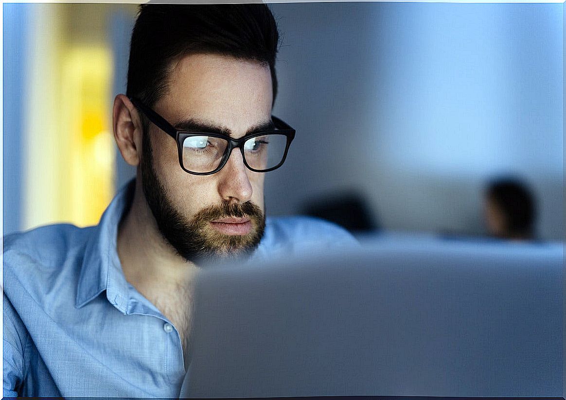 Man working on computer at night