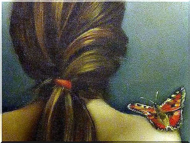 Butterfly on a bare shoulder