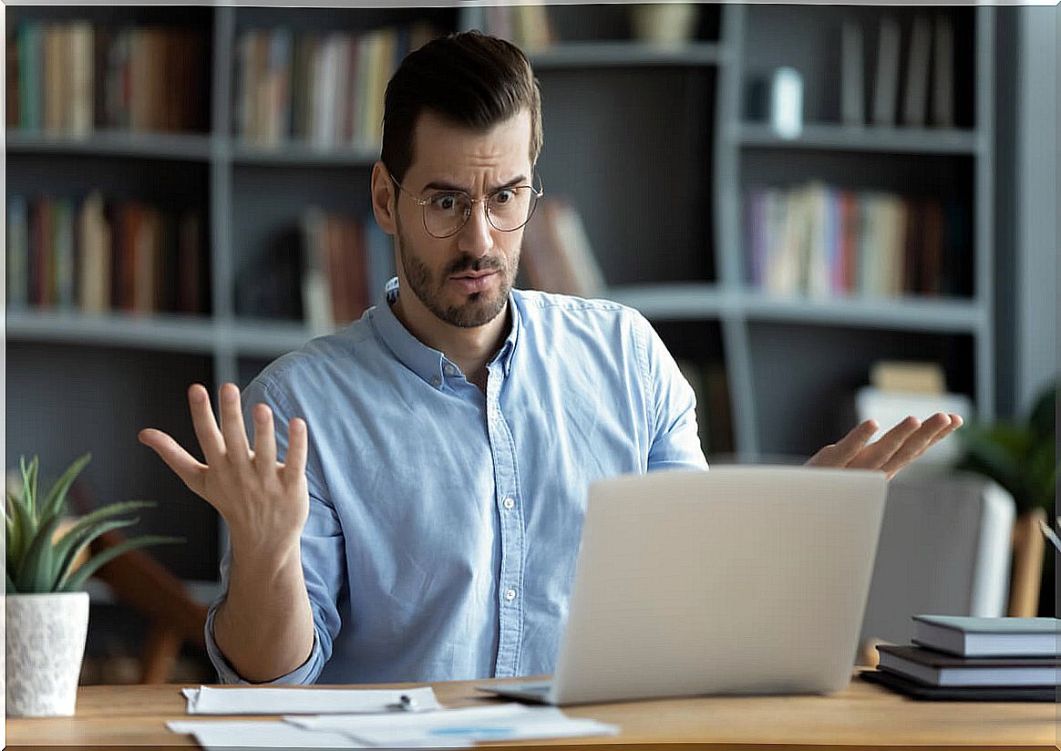 Nervous man with computer