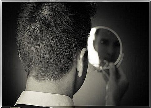 Man looking in the mirror