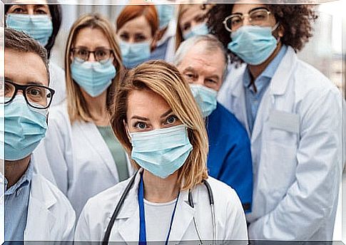 Health professionals with masks representing that empathy is more necessary than ever